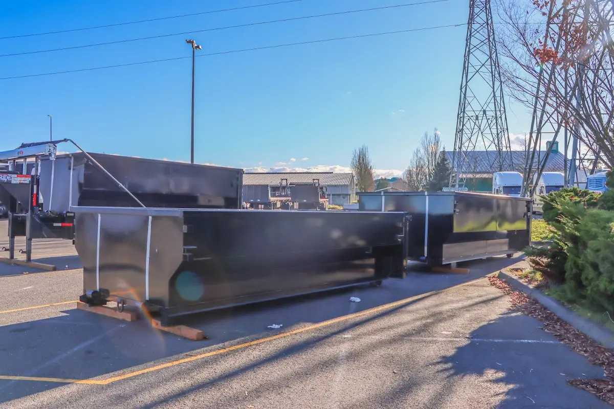 Roll-off dumpster ready for waste disposal at job site for Concrete Dumpster Rental in Bridge City